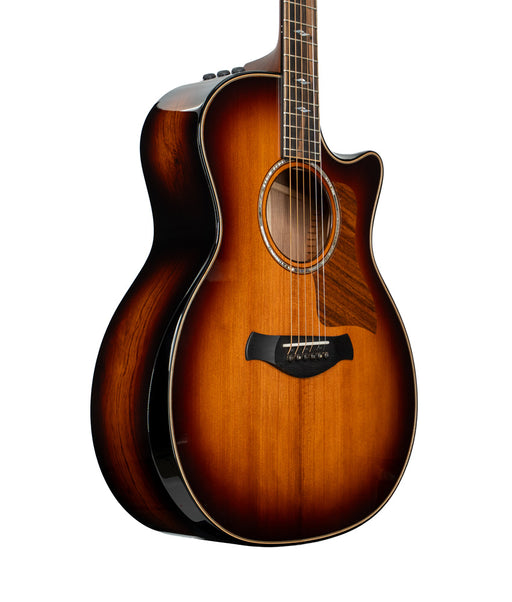Acoustic guitar with a sunburst finish on a white background